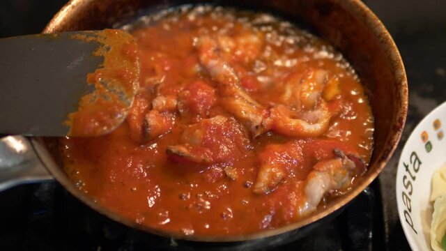 sizzling bacon and pasta sauce in the pac