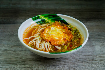Laksa with fried egg.