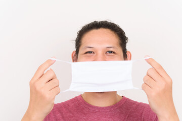 Portrait of Asian man wearing white fabric mask to protection corona virus outbreak and pollution