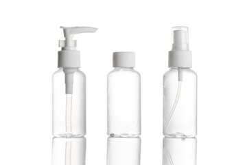 Sanitizer bottle. Empty clear plastic pump container for antiseptic gel, cosmetic soap and mineral shampoo isolated on white. Water cap blank spray on transparent background.