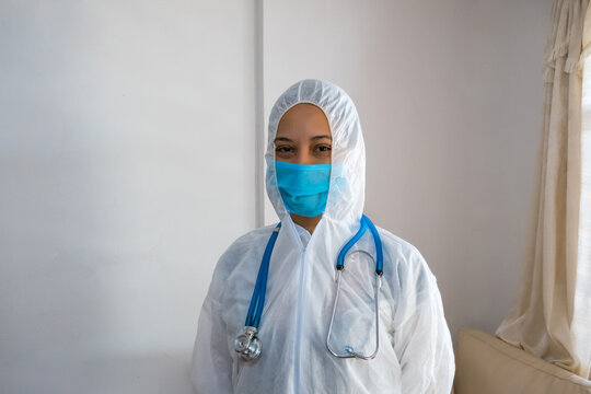 Doctor in protective medical suit, biohazard, after Coronavirus, covid-19 doctor's appointment. Concept of Medical Care