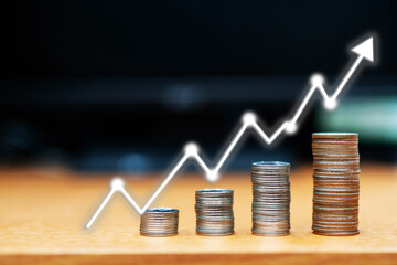 step of coins stacks with Stock market or forex trading graph, money, saving and investment or family planning concept.