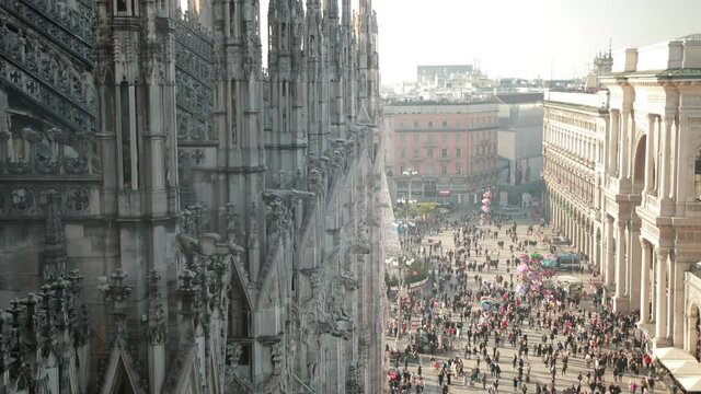 Sculptures saints and martyrs decorating the Cathedral Milan Duomo di Milano are shot close-up. Detail of luxury facade with many marble statues, reliefs.