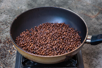 Traditional roasting coffee at home,  freshly roasted coffee beans.