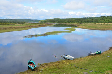 Varzuga, Kola Peninsula, Russia,  boats on the shore of Varzuga river