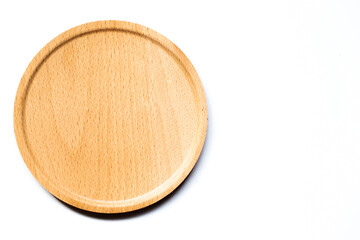 Top view of round wood tray on white background with copy space