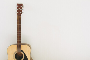 Naklejka premium Spanish acoustic guitar on white background