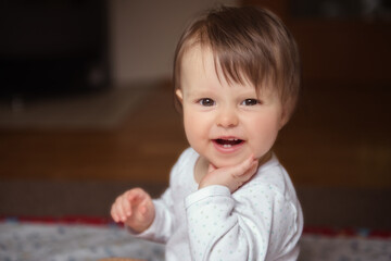 Beautiful baby girl smiling happily.