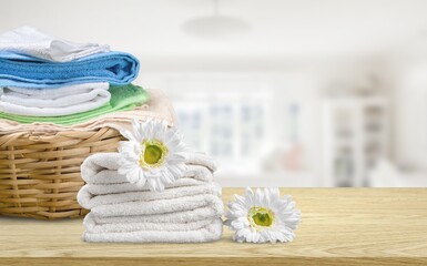 Laundry basket with colorful towels on desk