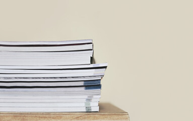 a stack of book on wooden table with copyspace background. education and learning concept.
