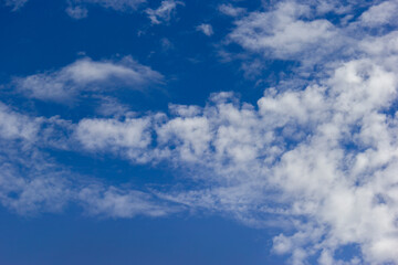 white cloud, contrails, vapour trails, jet streak on blue sky background
