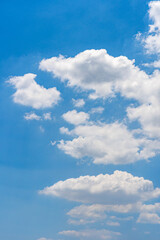 Fototapeta na wymiar Vertical photo of cumulus white cloud on bright blue sky 