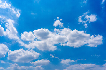 Naklejka na ściany i meble Beautiful blue sky with white clouds floating