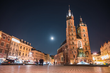 Naklejka na ściany i meble Krakow Old Town with view of St. Mary's Basilica at night