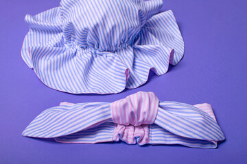 Cute children's headband and hat for women, girls or baby on a lilac background.