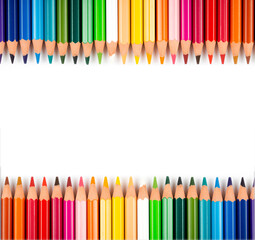 Multicolored pencils isolated on a white background. Free space for text. Education frame concept.