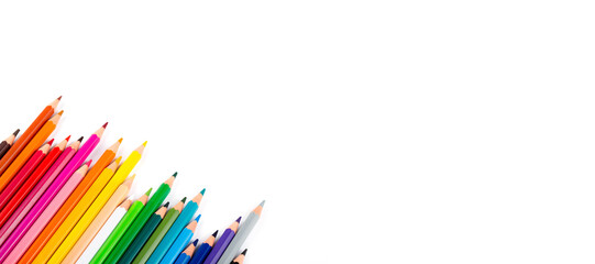 Multicolored pencils isolated on a white background. Free space for text. Education frame concept.