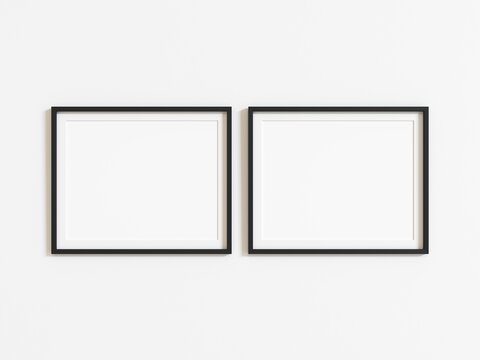 Two black horizontal frames mockup on white wall. Landscape frame. 3d illustration.