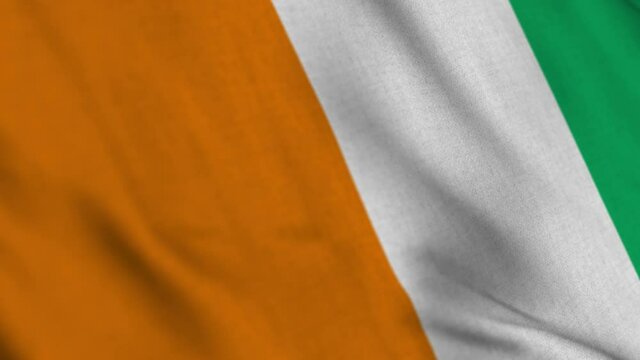 Ivory Coast Cote D Ivoire national flag waving with fabric texture fluttering in wind in a seamless loop in smooth slowmotion animation background