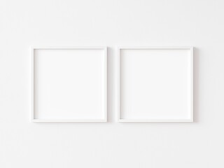 Two square white frame mock up on white wall. 3d illustration.