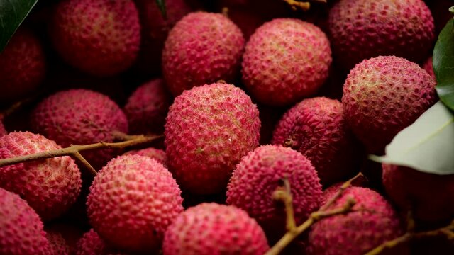 Close-up of fresh lychee. Close-up Red lychee exotic fruits shot with slide or move camera. 4K Resolution