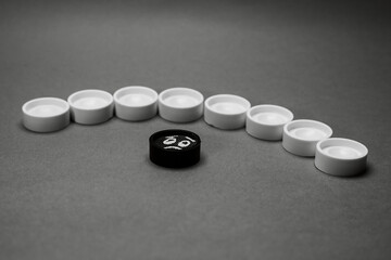 Faces on checkers in the form of facial expressions that reflect emotions. The concept of racism, misunderstanding, a barrier in relations, the denial of society. Barriers between people.