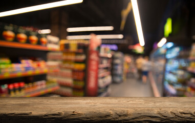 Wood top table on blur supermarket background