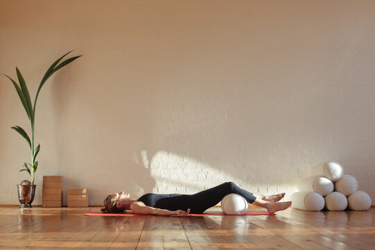 Woman doing breathing exercise in shavasana