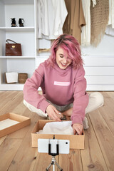 Happy hipster gen z teen girl fashion social media channel blogger pink hair wear hoodie record...