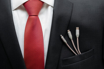 Business suit with different mobile phone cables in pocket. Business partnership. Business communication concept. Business company people. Power energy.