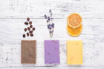 Top above overhead view photo of handmade organic soap bars with coffee beans lavender and dried...