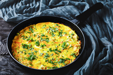 Fried omelette with zucchini, leek, and carrot