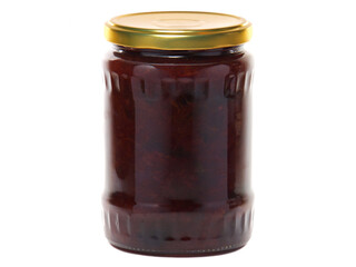 Plum jam in a glass jar isolated on white background