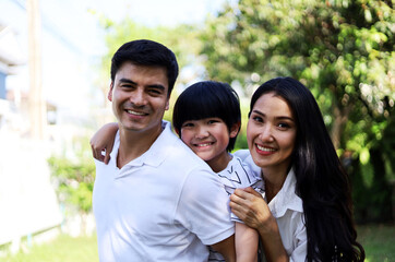 Happiness young family in holiday activities weekend at garden park.