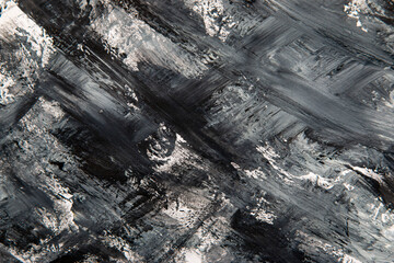 strokes of black paint on a white background as an abstract background