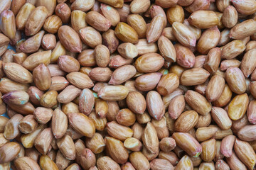 The peeled raw peanuts closeup macro pattern background