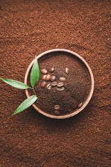 Wooden bowl on coffee powder