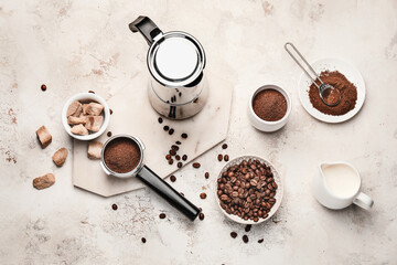 Composition with coffee beans and powder on light background
