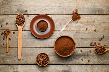 Composition with coffee beans and powder on wooden background