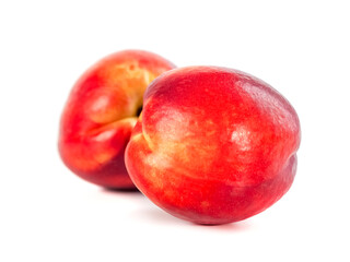 Fresh organic peaches isolated on white background