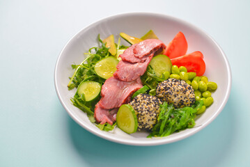 Fresh and organic vegetable salad with raw veggies - tomatoes, cucumbers, avocado. Flat lay, copy space banner.