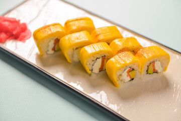 Sushi rolls philadelphia or california with cheddar and creame cheese, with tuna and avocado.