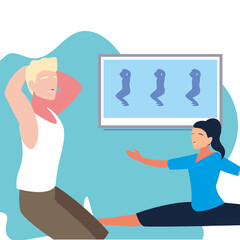 couple doing guided exercises on television