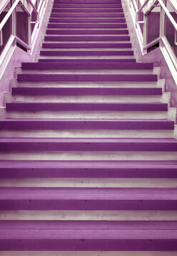 Vertical image of pop art style purple colored empty staircase in a modern building
