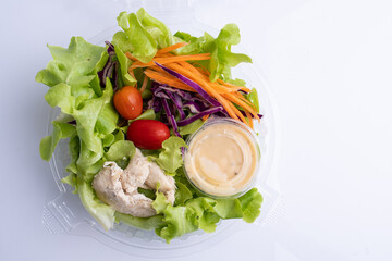 Fresh salad with chicken Roast fillet with tomato on white background