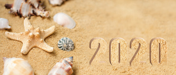 Fototapeta na wymiar Rest 2020. Vacation memories from beach, seashell and starfish. Summer beach background travel concept. Banner.Copy space for text.