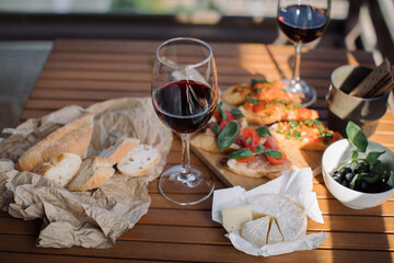 Romantic dinner on the rooftop terrace. Italian antipasti wine snacks set.