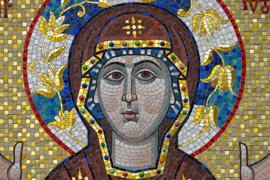 The Christian Virgin and Child Jesus in the form of ceramic mosaics on the facade of the Orthodox church. Traditional christian greek decor and fresco.