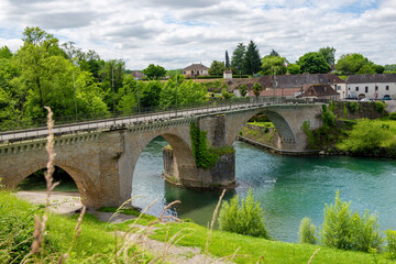 Fototapeta na wymiar Ancient bridge over the river Gave d`Oloron at town of Navarrenx, France.
