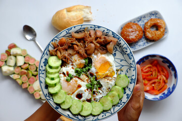 woman hand prepare food for breakfast, plate of omelet, cucumber non meat diet for healthy eating